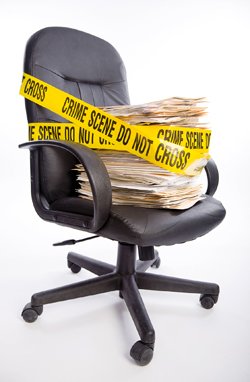 Office chair wrapped in police tape