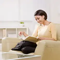 Woman relaxing and reading a book