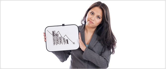 Woman holds bar chart showing downturn