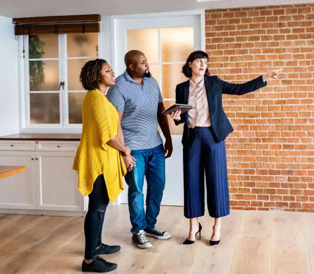 couple viewing a home with their REALTOR